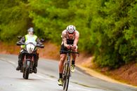 Sportsman riding on bike under control during competition
