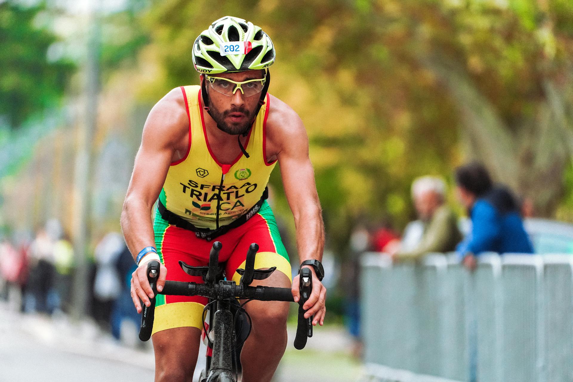 Focused athlete cycling during a triathlon race, showcasing endurance.