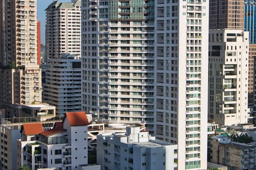 A cityscape view of modern skyscrapers and buildings in Bangkok, Thailand, showcasing urban architecture.