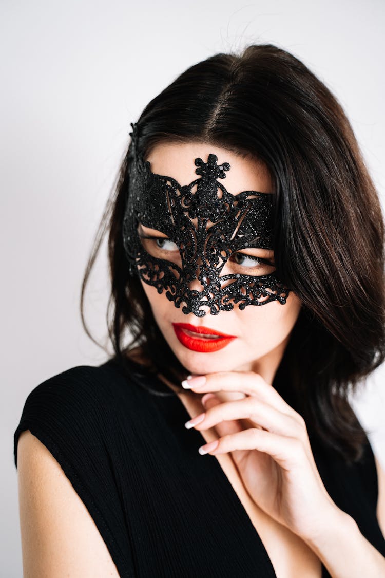 A Woman Wearing A Black Mask