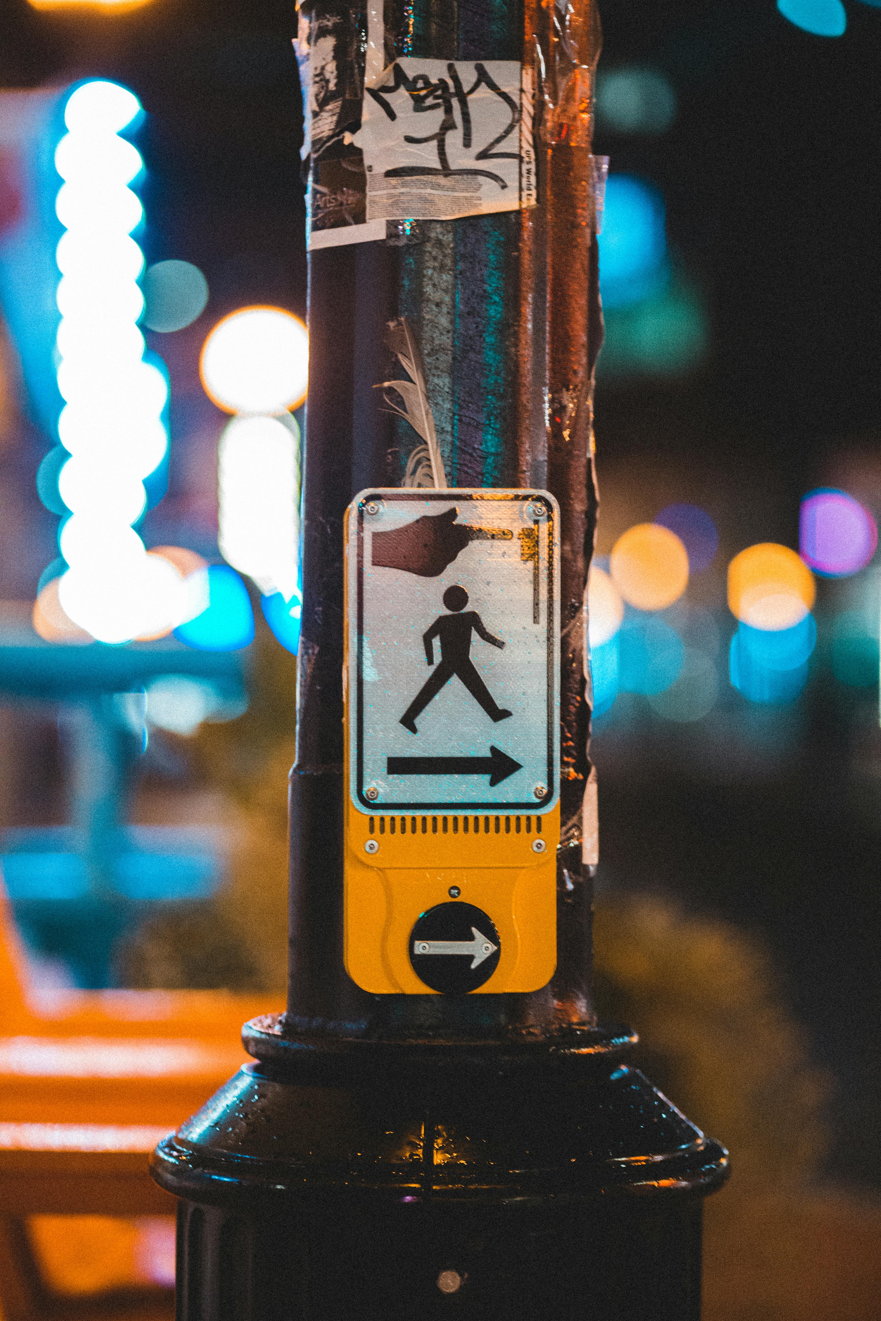 pedestrian crossing call button in street