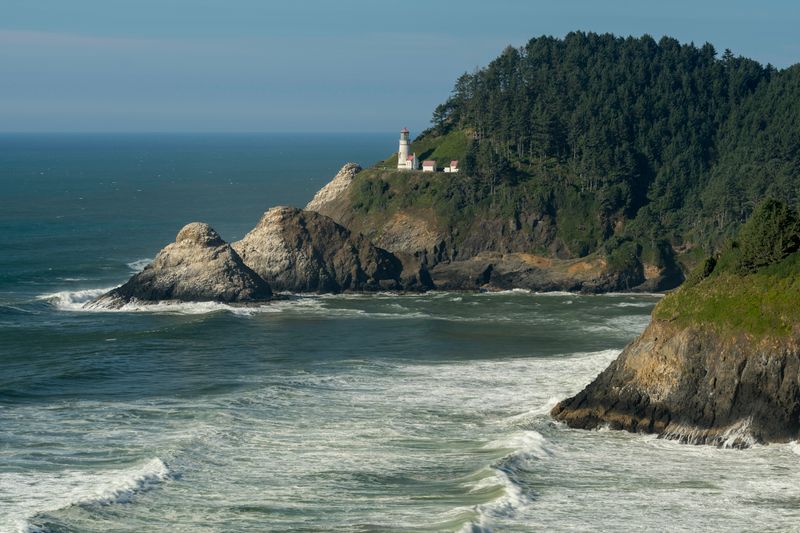 Scenic view of Heceta Head Lighthouse overlooking rocky Pacific coast in Florence, Oregon.