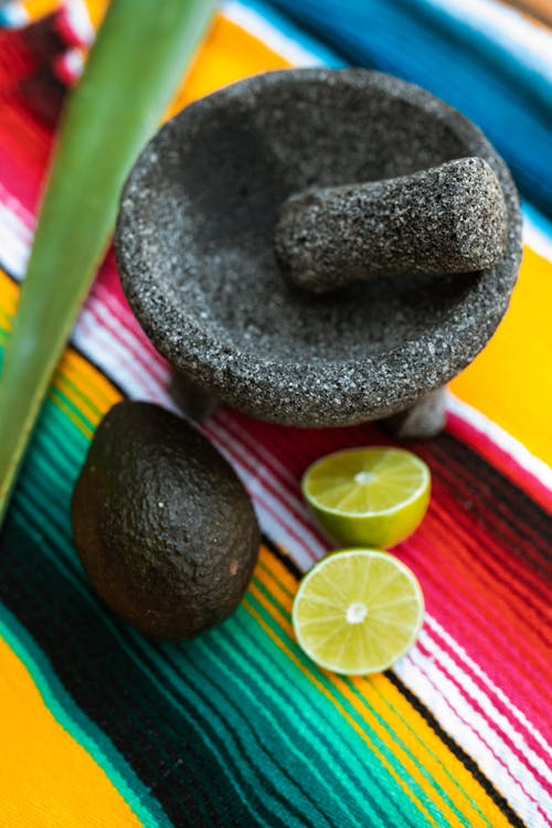 https://www.pexels.com/photo/fruits-and-stone-mortar-and-pestle-on-a-colorful-textile-5737236/