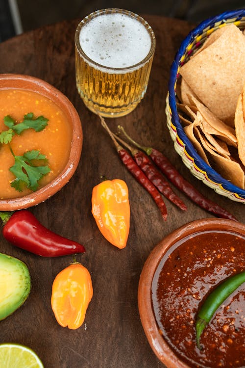 Free Assorted Chilies on Brown Wooden Table Stock Photo