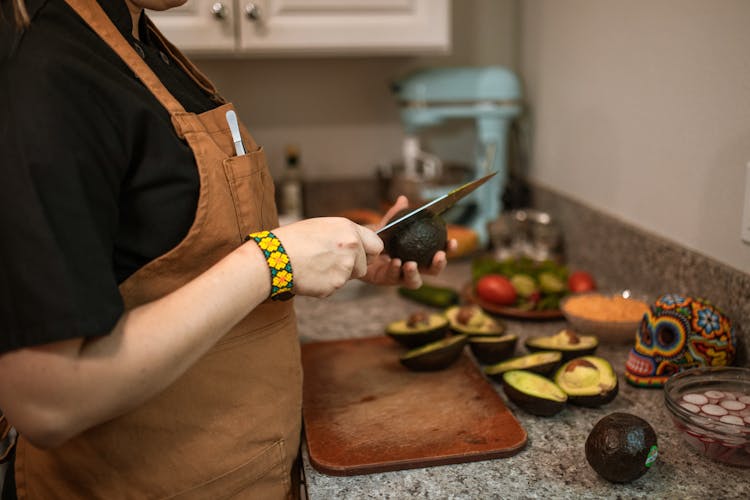 A Person Slicing Avocado