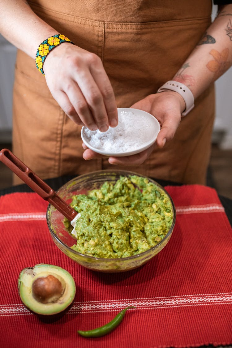 A Person Making Guacamole