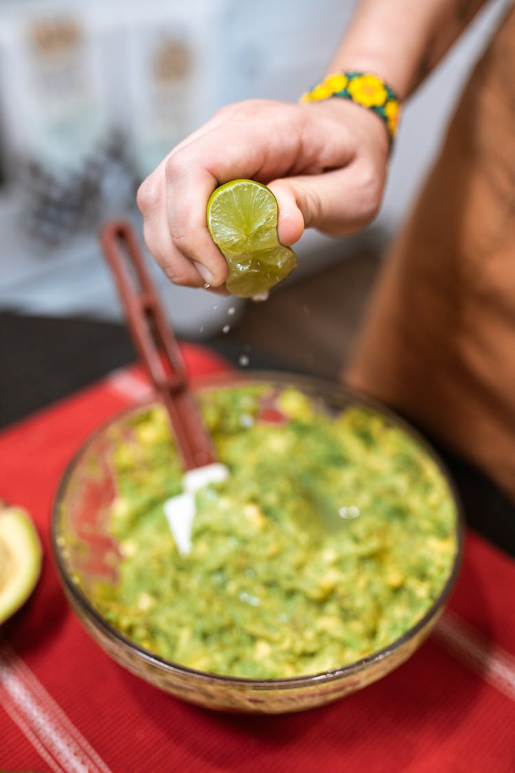 A Person Squeezing Lime