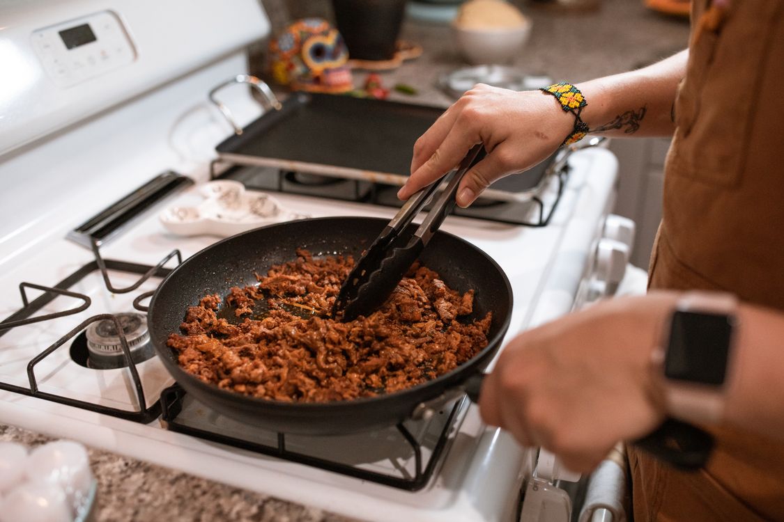 Seasoned ground beef cooking in a skillet