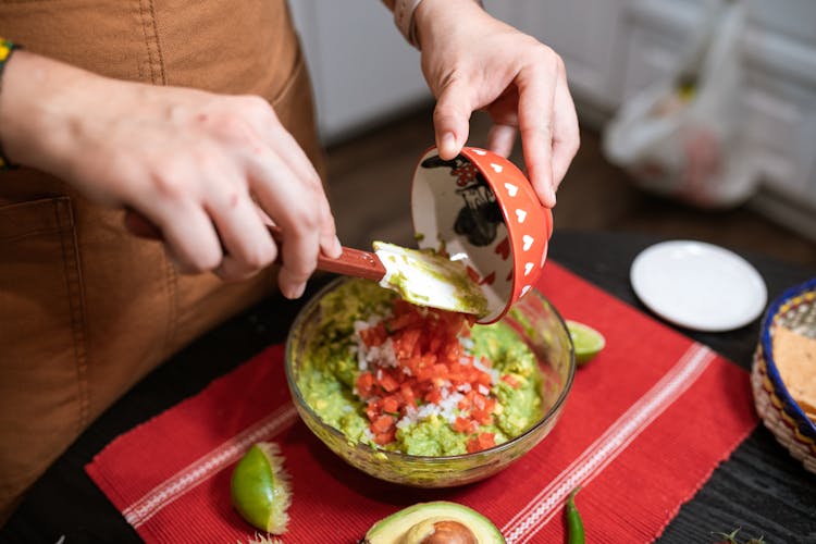 Person Making Guacamole