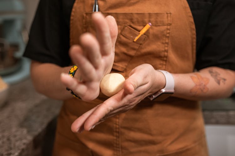 Person Rolling A Dough