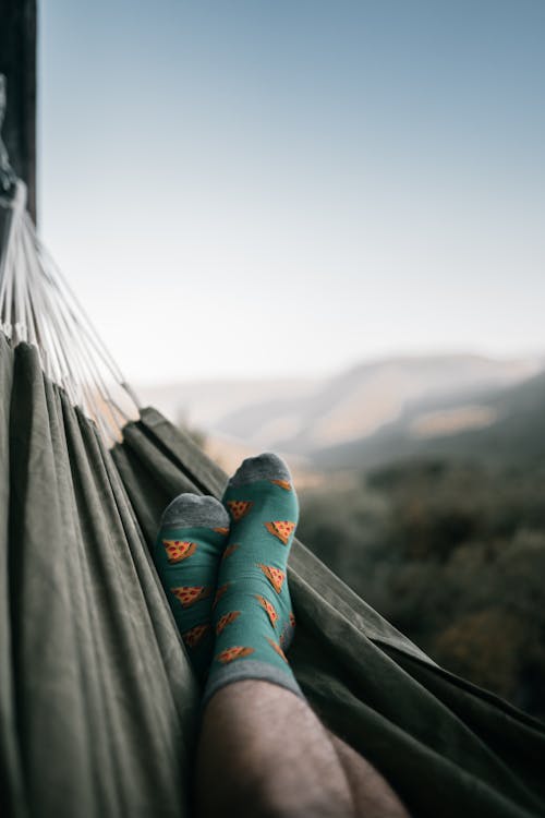 A Person Wearing a Socks while Chilling on a Hammock