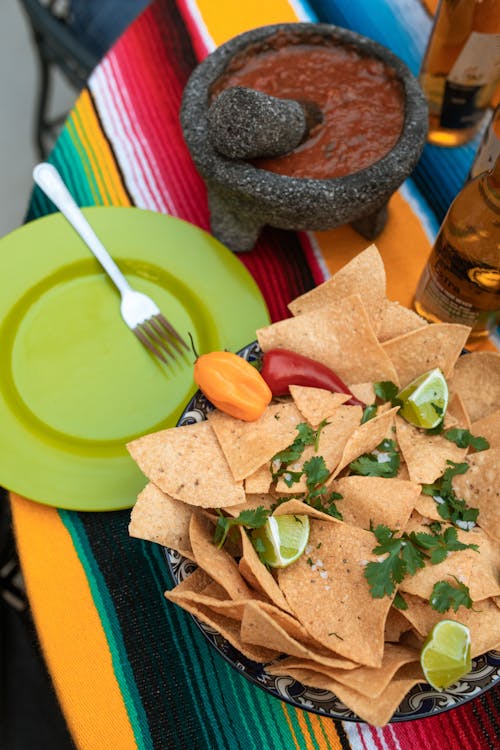 Free A Tortilla Chips Near the Salsa on a Bowl Stock Photo