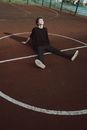 Dreamy male teen with closed eyes leaning with hands on recreation ground in daytime