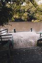 Brown Wooden Bench Near Body of Water