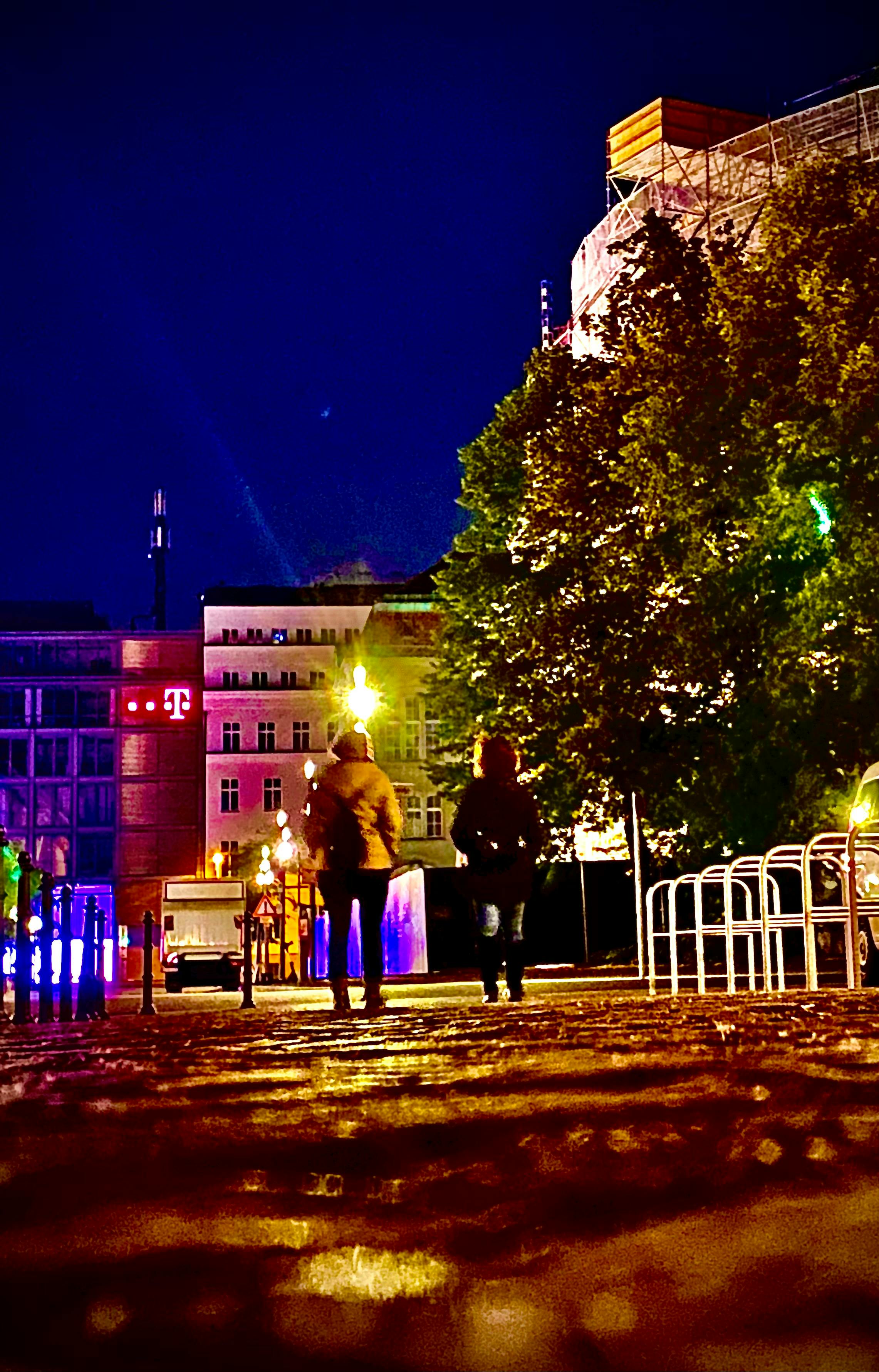 Tennis doubles match with a man and woman on opposite sides of the net