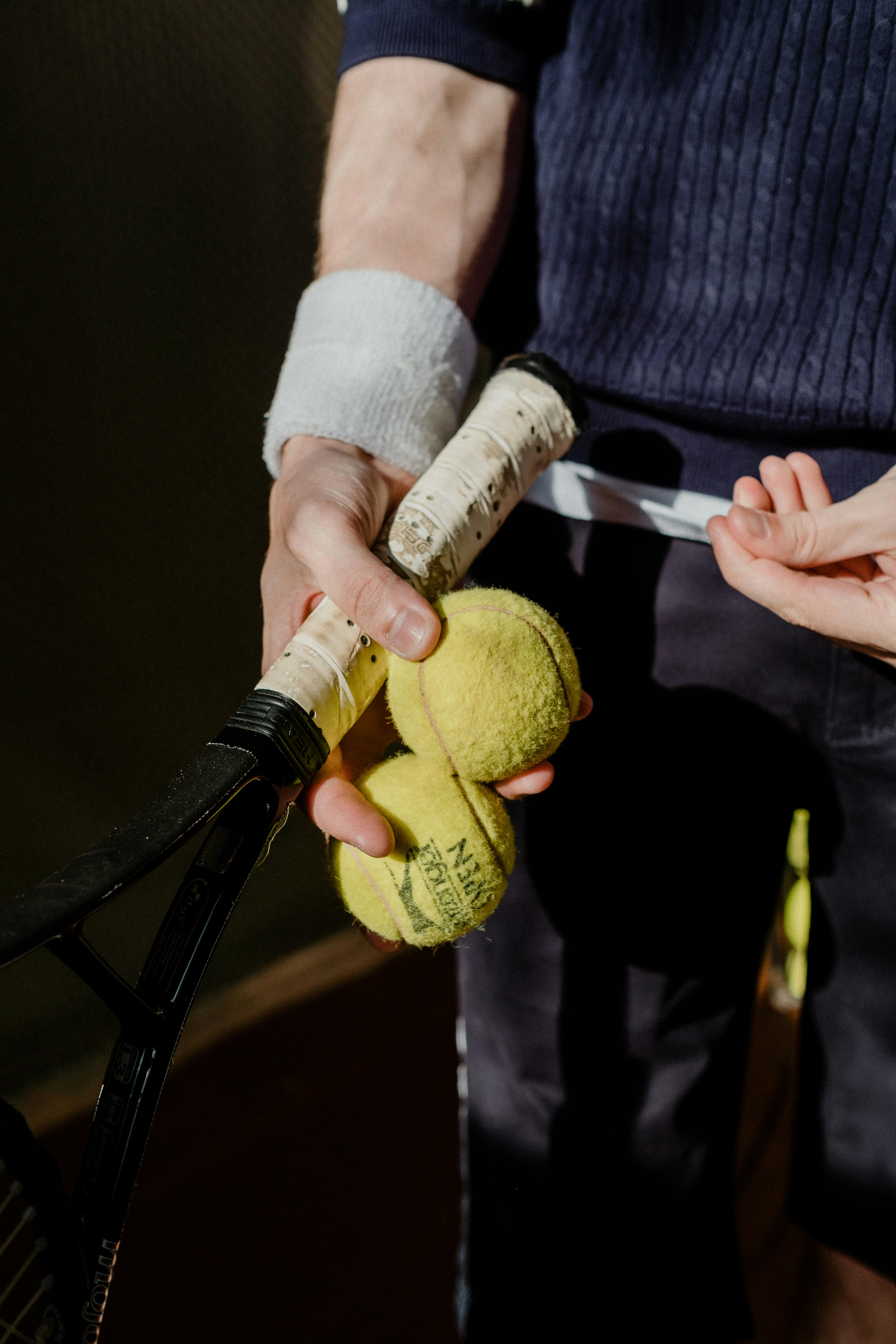 a person holding a tennis racket