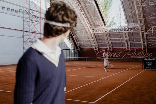Free A Man Standing on the Tennis Court Stock Photo