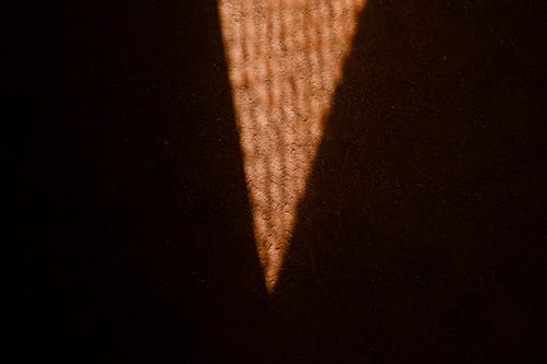 Triangle Shaped Light on the Dirt Ground