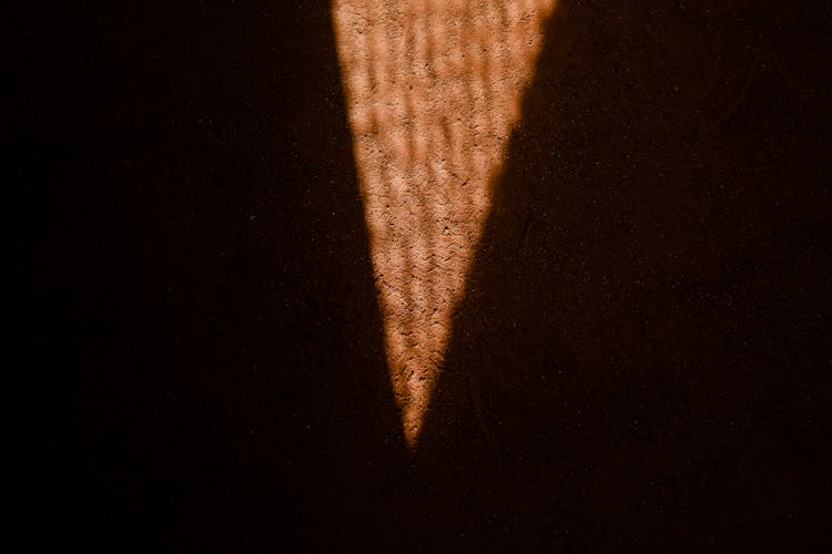 Triangle Shaped Light On The Dirt Ground