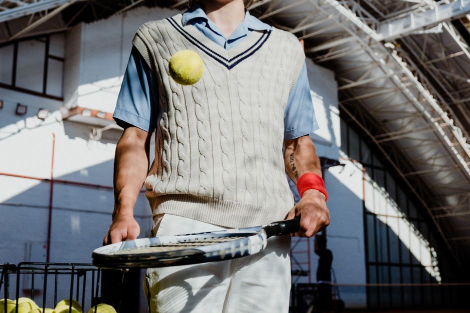 Player serving with the Indoor Clay Specialist racket