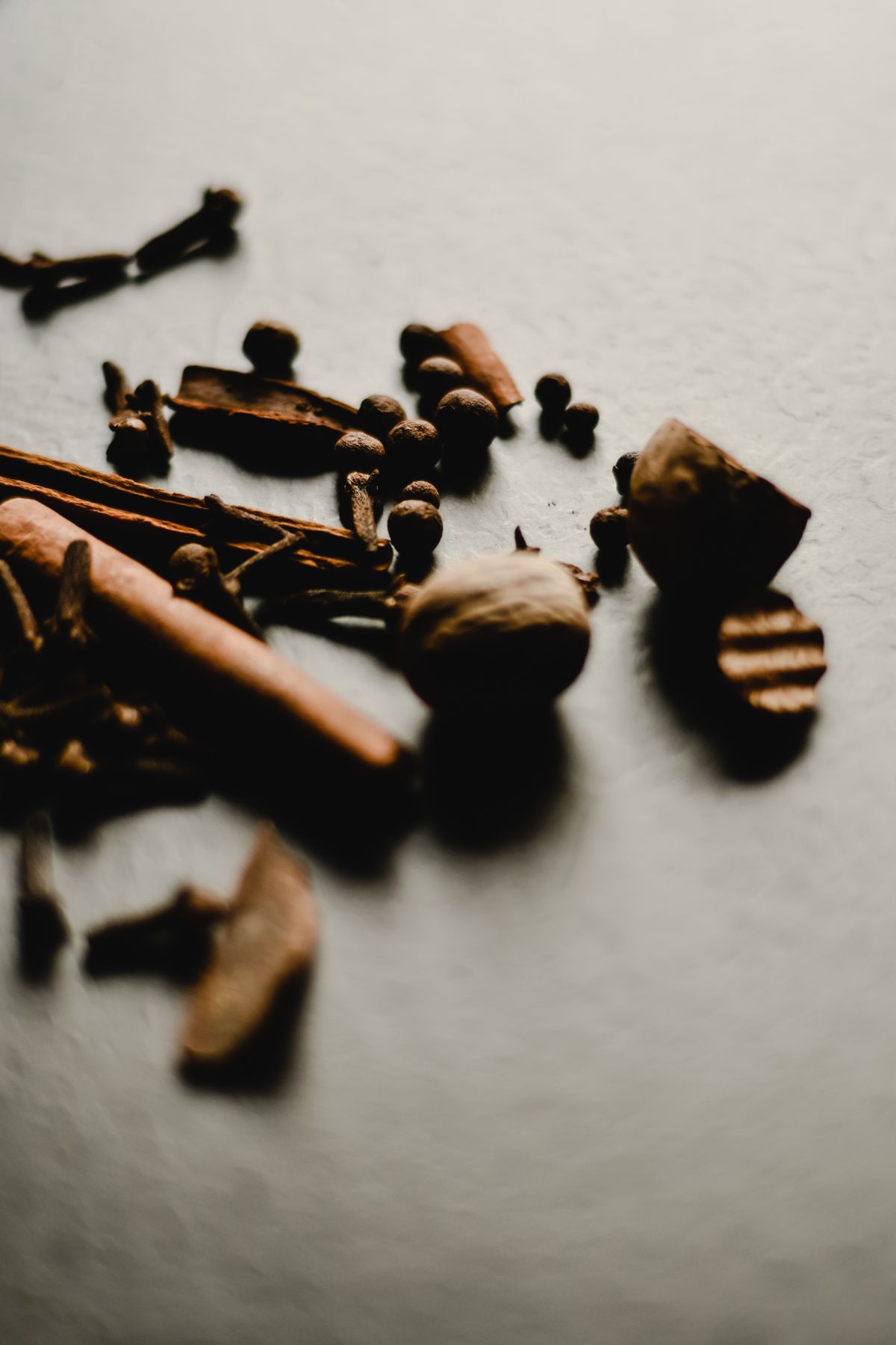 Whole spices and cinnamon in a still life — visual inspiration for Spicy Spices