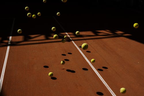 Free Green Tennis Ball on the Tennis Court Stock Photo
