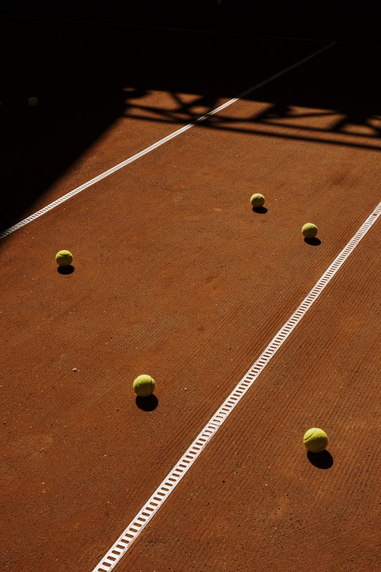 Green Tennis Balls On The Court