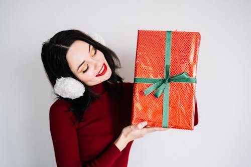 Free A Woman Holding a Gift Stock Photo