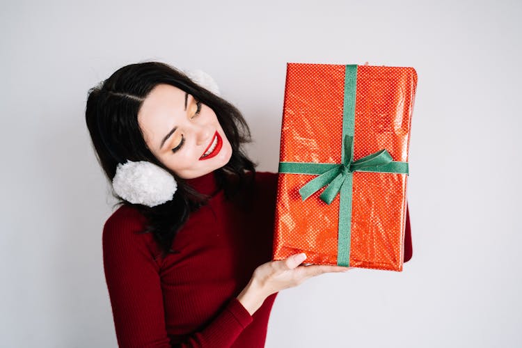 A Woman Holding A Gift