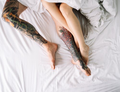 Free Couple Lying on Bed  Stock Photo