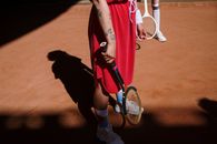 Woman in Red Tank Top and Black Shorts Holding Tennis Racket