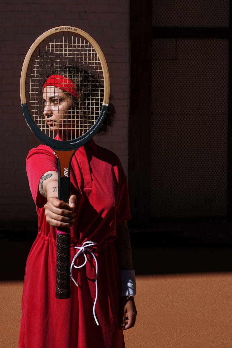 Woman With Red Sweatband Looking Afar 