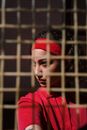 Woman in Red Hoodie Wearing Red Knit Cap
