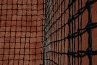 Chain Link Tennis Net in a Clay Court