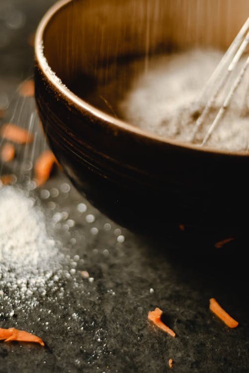 Close-up of Whisking on Wooden Bowl