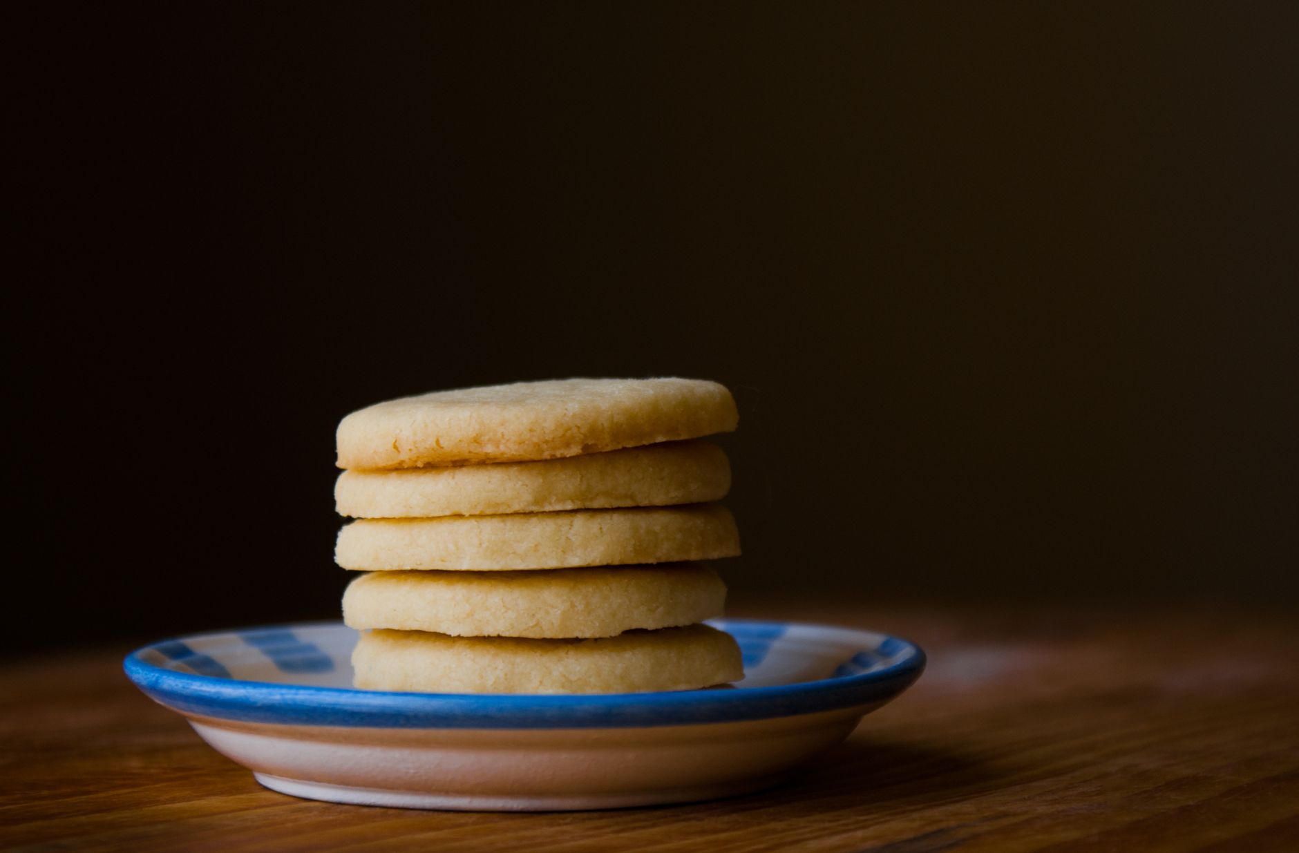 close-up of golden brown baked cookies on wire rack