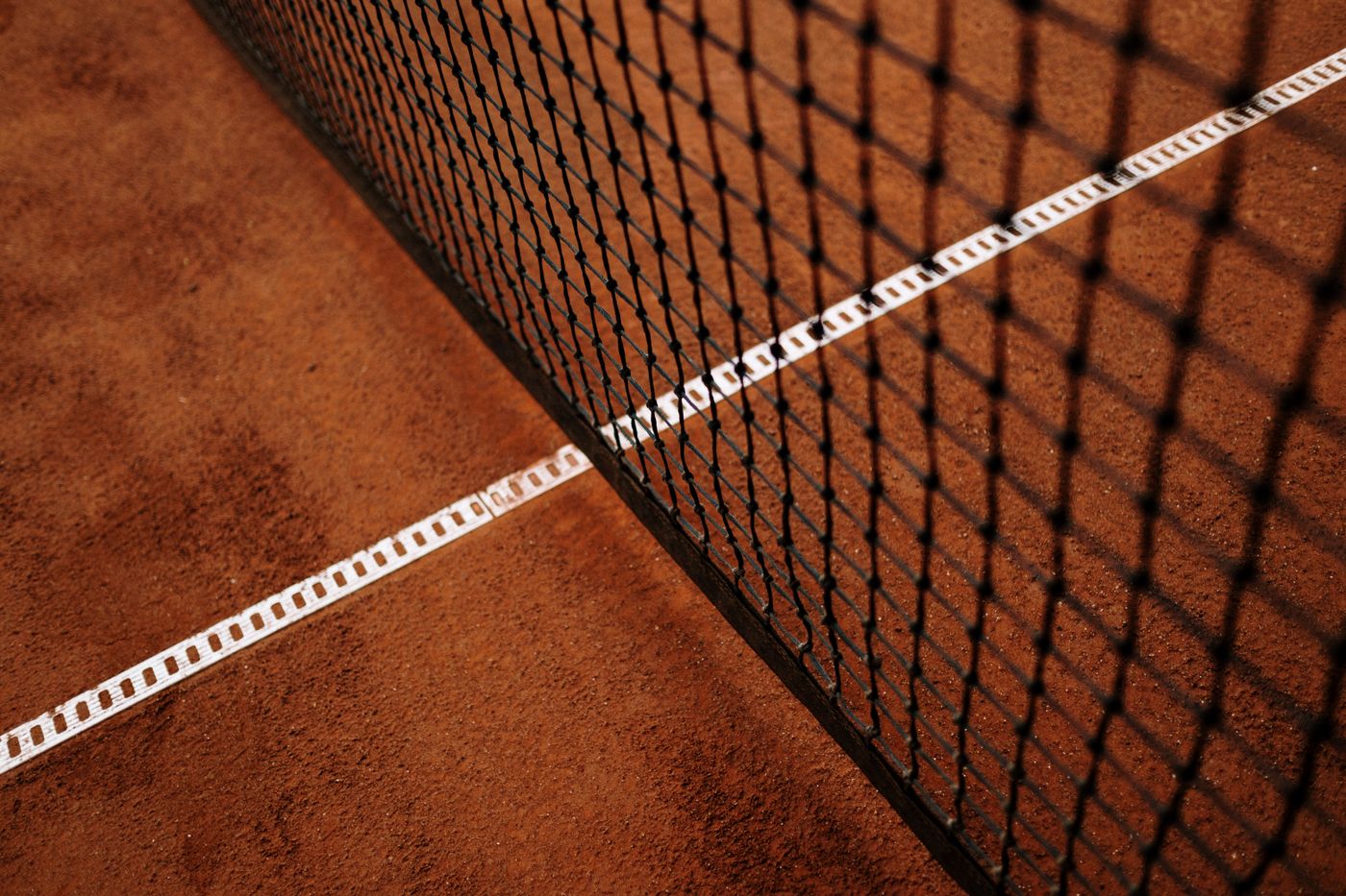 Clay court net and baseline