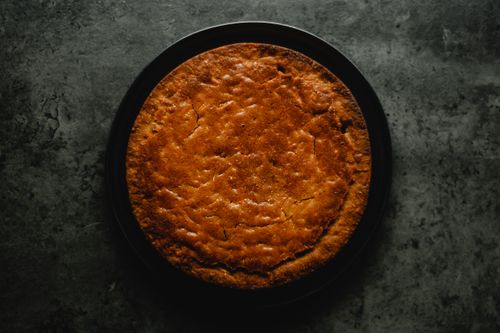 Free A delicious homemade carrot cake on a black plate, perfect for dessert lovers. Stock Photo
