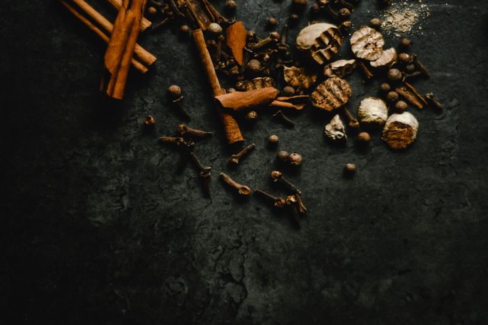 A collection of aromatic spices including cinnamon and cloves
