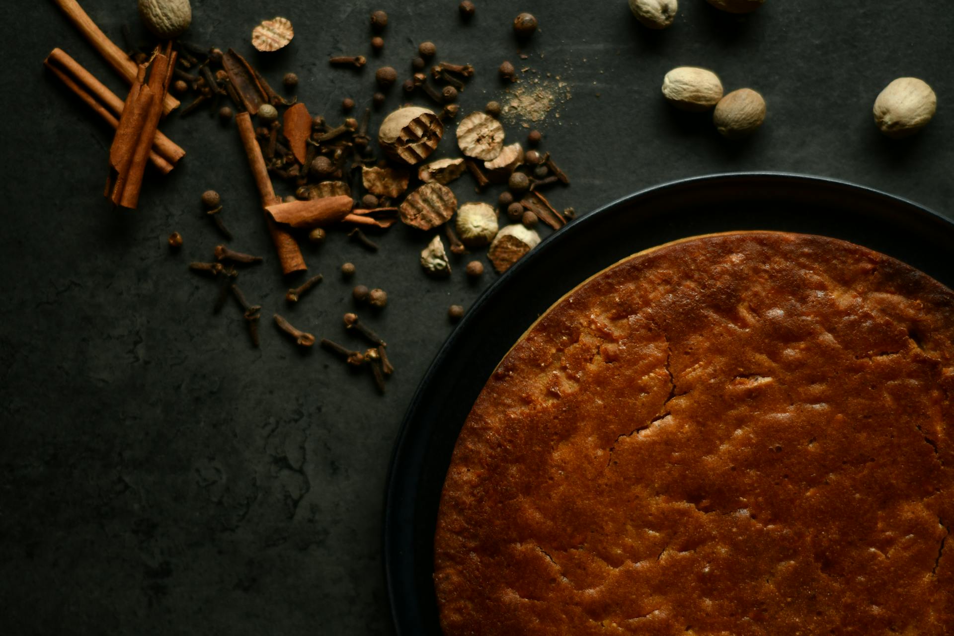 Dried Herbs and Spices Near a Brown Pie