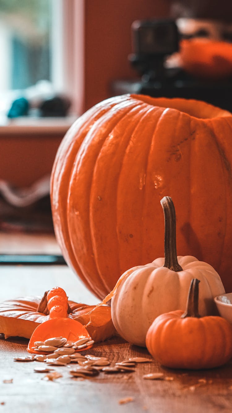 Carving A Orange Pumpkin To Make A Jack O' Lantern