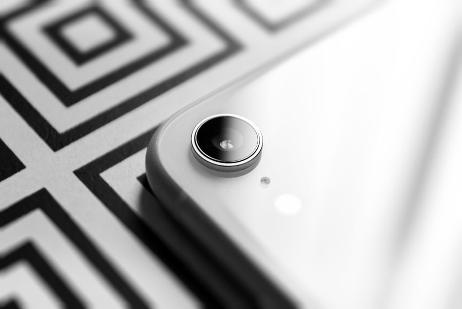 Corner detail of a slim white handset. Photo by Akshar Dave on Pexels