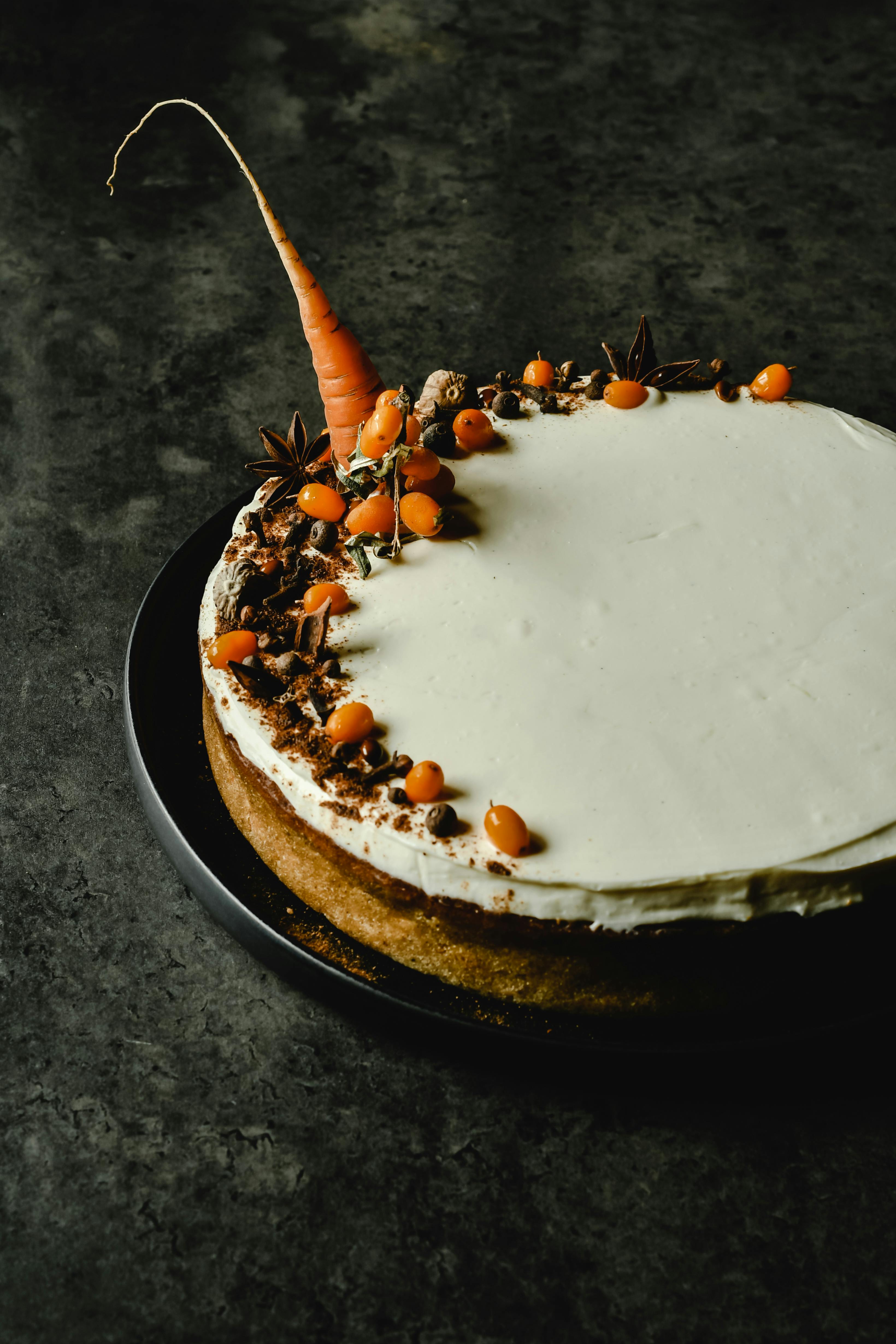 dried herbs and fruit toppings on a carrot cake