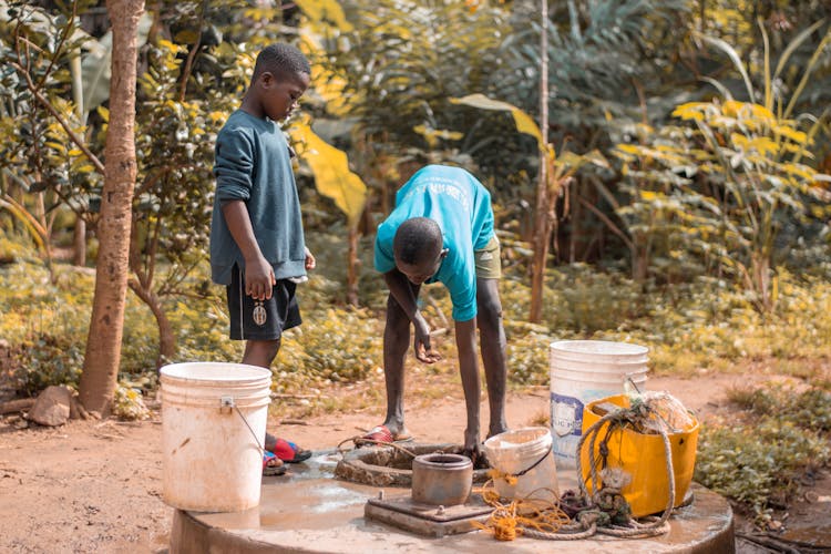 Children Getting Water In Jungle Forest