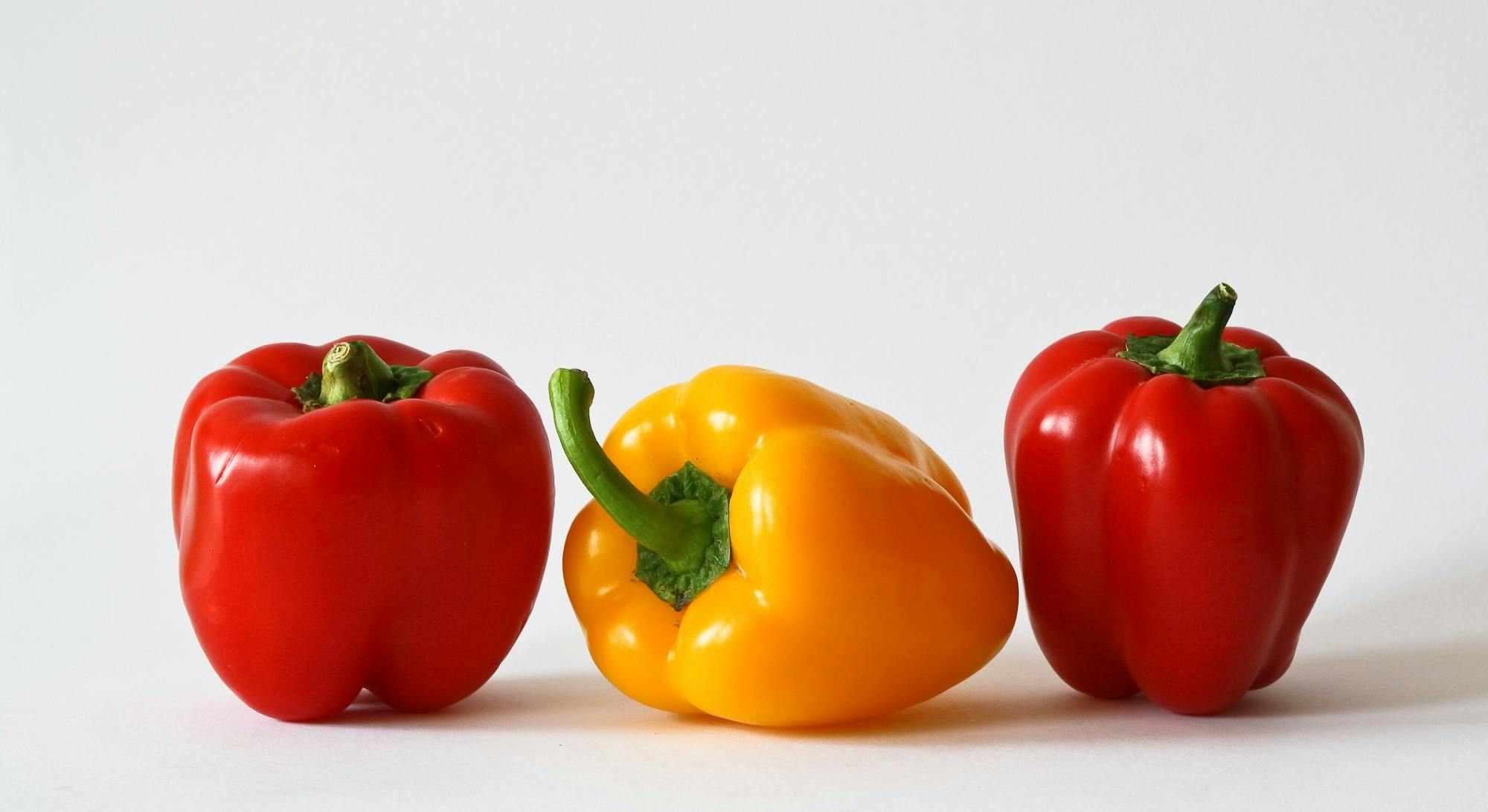 Download Yellow Bell Pepper Between 2 Red Bell Pepper Free Stock Photo PSD Mockup Templates