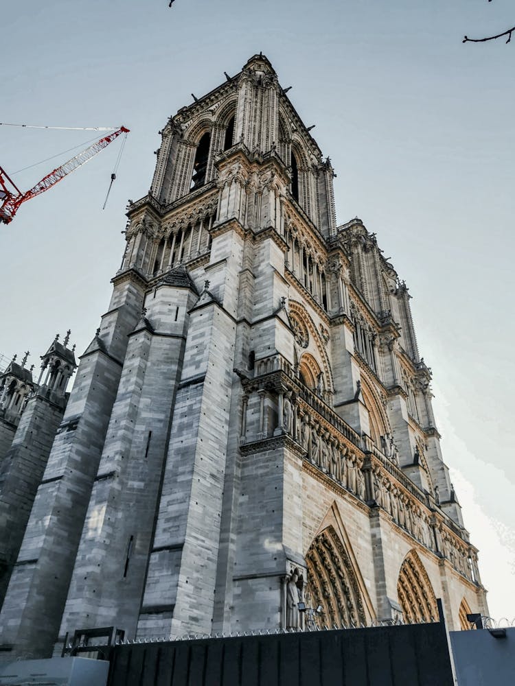 Facade Of Notre Dame De Paris Under Light Sky