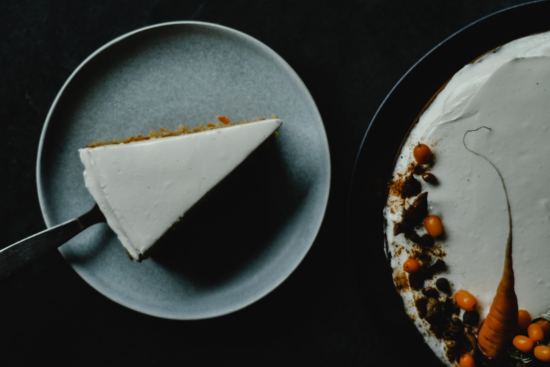 Whipped topping freshly spread over Pumpkin Cream Cake