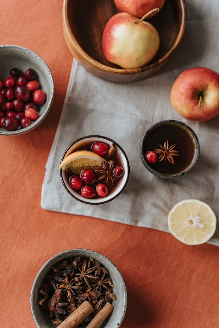 Cranberries And Lemon Wedge On Mulled Wine