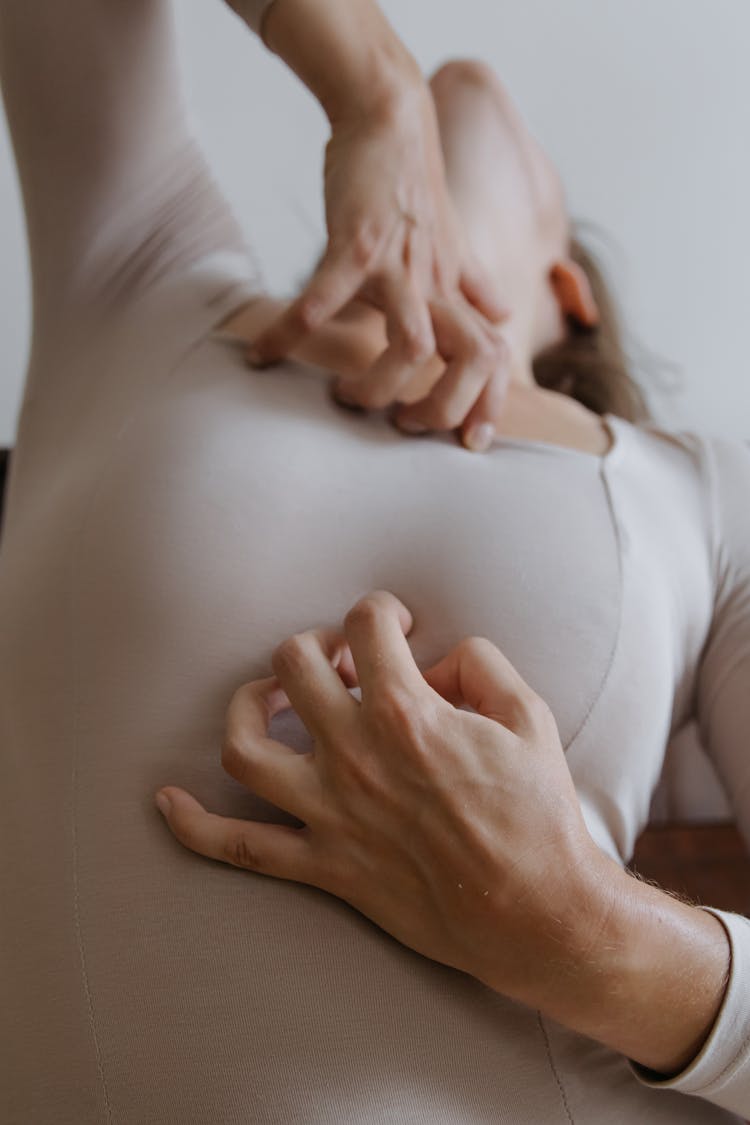 Woman Scratching Her Chest 