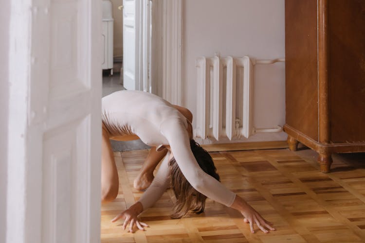 Woman Crawling On The Wooden Floor